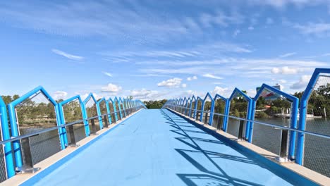 empty blue bridge under clear sky