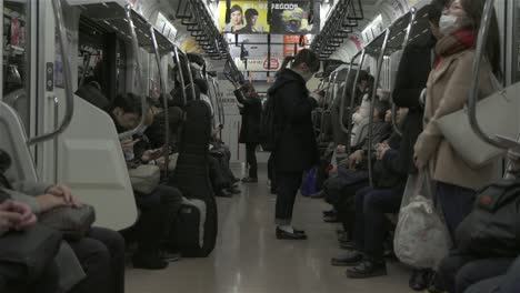 inside carriage of tokyo subway