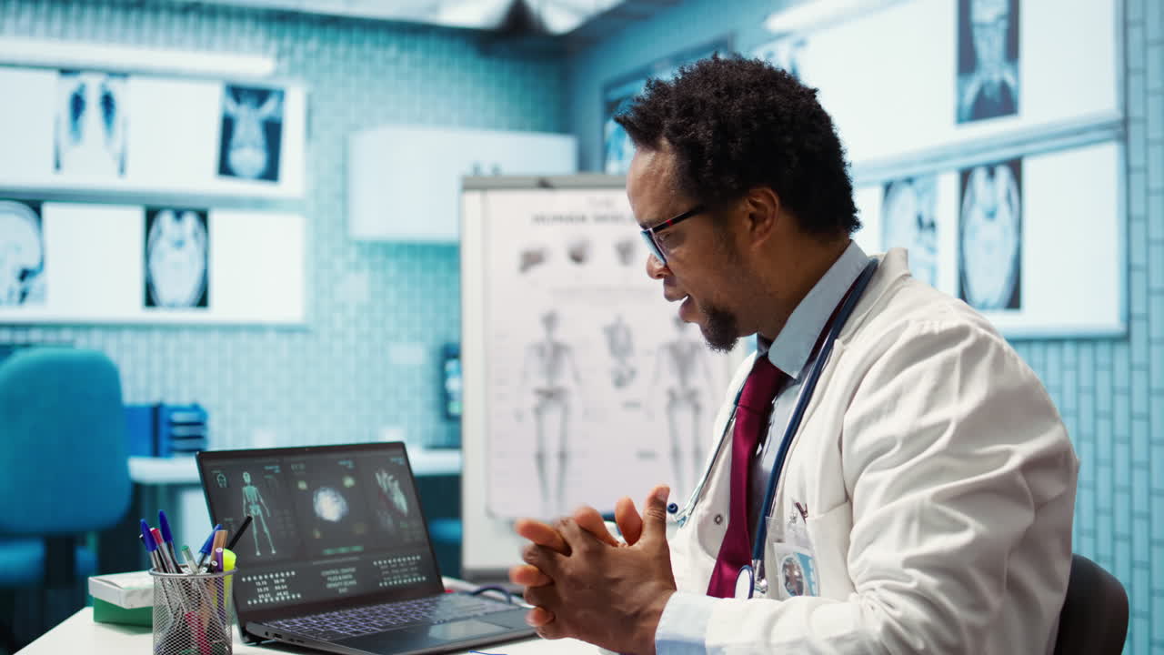 General practitioner putting his medical disposable gloves on before examining