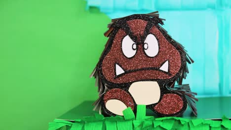 mario bros-themed goomba decoration with a playful backdrop of bright colors and fun textures
