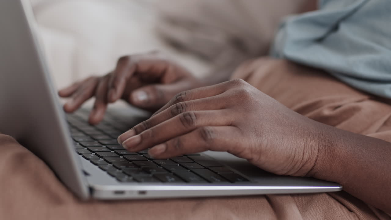 Unrecognizable African-American Woman Working on Laptop