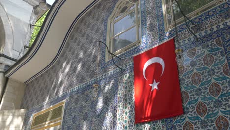 turkish flag on a historically decorated building in istanbul