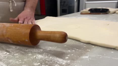 pastry chef prepares puff pastry in his artisanal worshop in jerica, spain