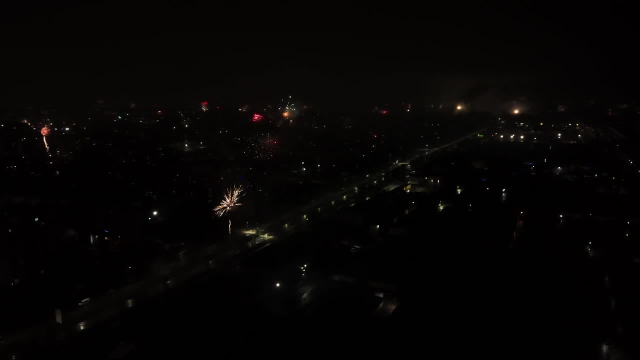 Spectacular fireworks show over an entire city at night. Aerial view