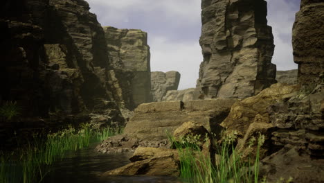 natural rock formations near calm water with lush greenery in tranquil setting