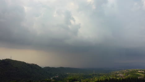 Cinematic-drone-footage-of-a-thunderstorm-over-mountains-in-Tagaytay,-Phillipines,-Asia,-Aerial,-Cinematic