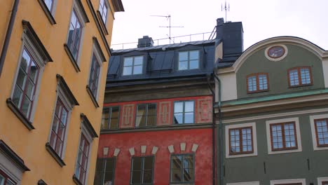 old and colorful buildings in gamla stan, stockholm, sweden - panning shot