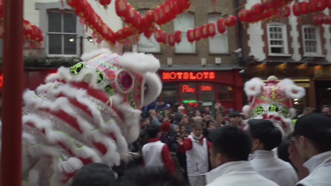Dragon dancers in china town london england during new year celebration parade
