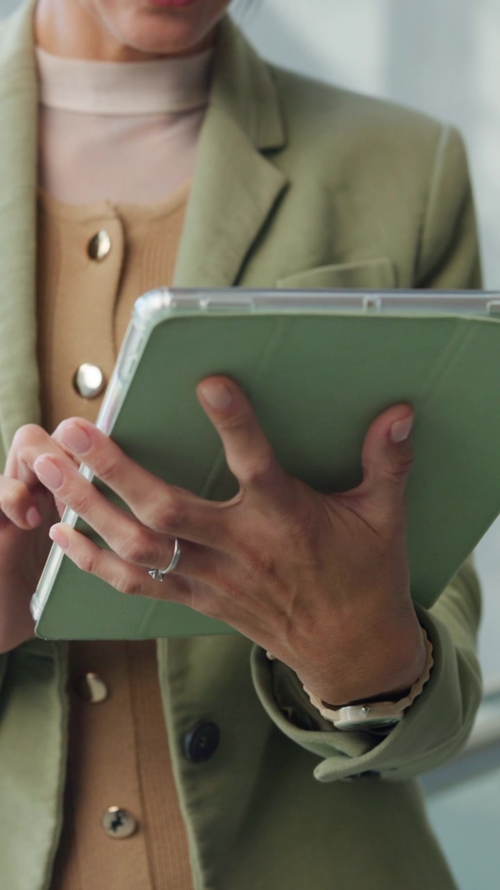 Professional Woman Using Tablet in Office Setting