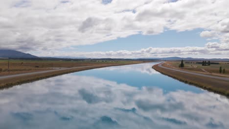 cloud reflection in pukaki canals outside twizel, canterbury