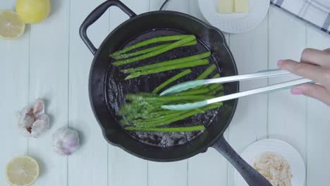 top down view of green asparagus cocked in olive oil pan organic healthy vegan vegetarian plant based food diet