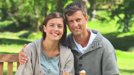 young couple sitting on a bench