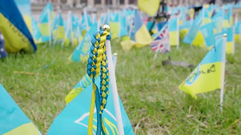 detailed closeup of blue and yellow woven decoration on top of small ukraine flag