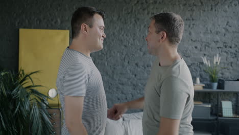 happy gay couple in their bedroom