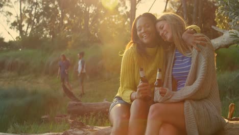 women embracing each other in the forest 4k