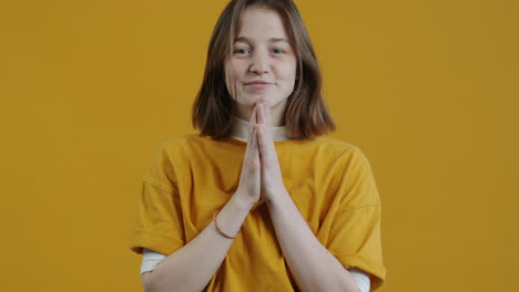 woman smiling and praying