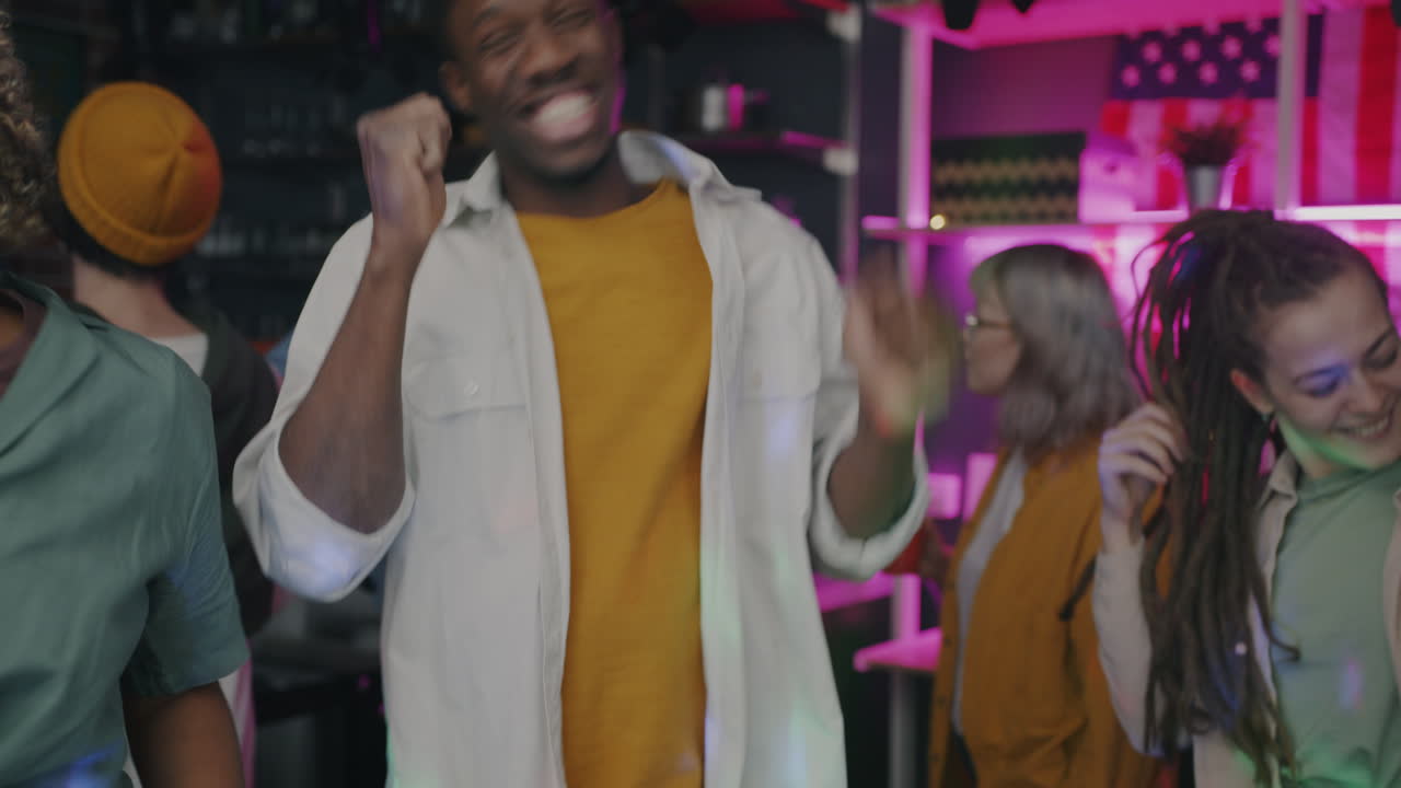 Group of friends dancing at a party