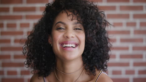close up portrait beautiful young hispanic woman laughing cheerful enjoying success happy independent female student