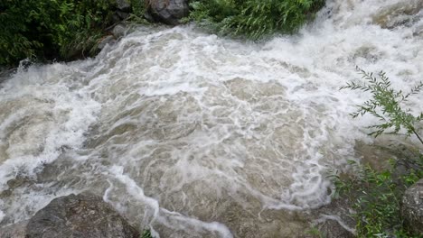 raging water in mountain river after rainstorm