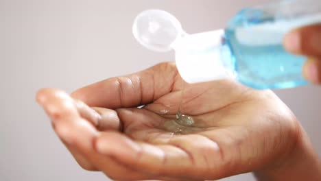 applying hand sanitizer