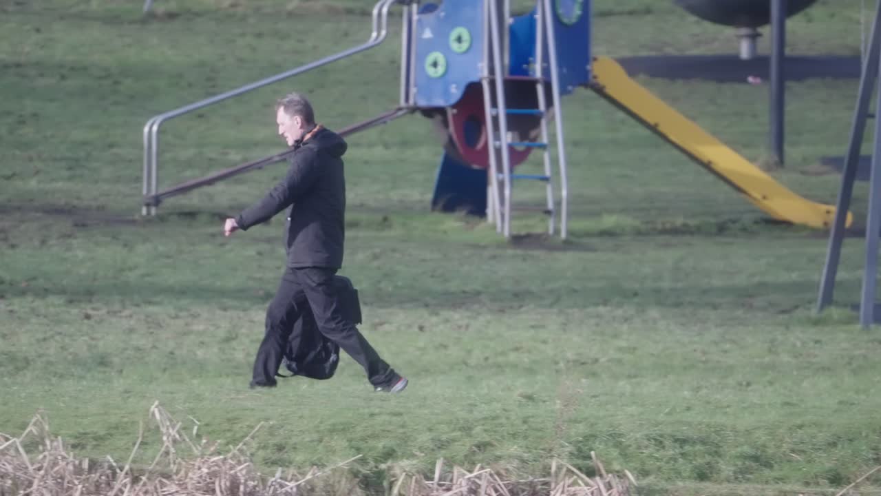 Middle-aged man, park exercise, backpack carry, slow motion scenery