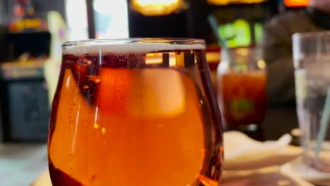 bubbles rising in glass of alcohol