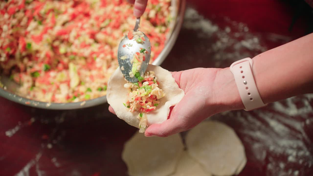 Filling and folding dumpling wrapper by hand