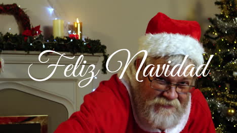 animation of feliz navidad text over santa claus at christmas