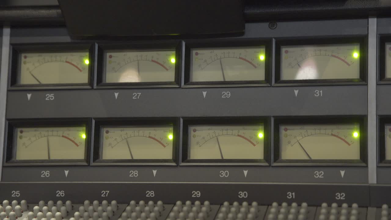 Signal peak gain on VU meter in studio handheld shot