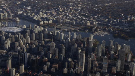 aerial view of vancouver skyline from a plane - bc place and cambie bridge seen from above