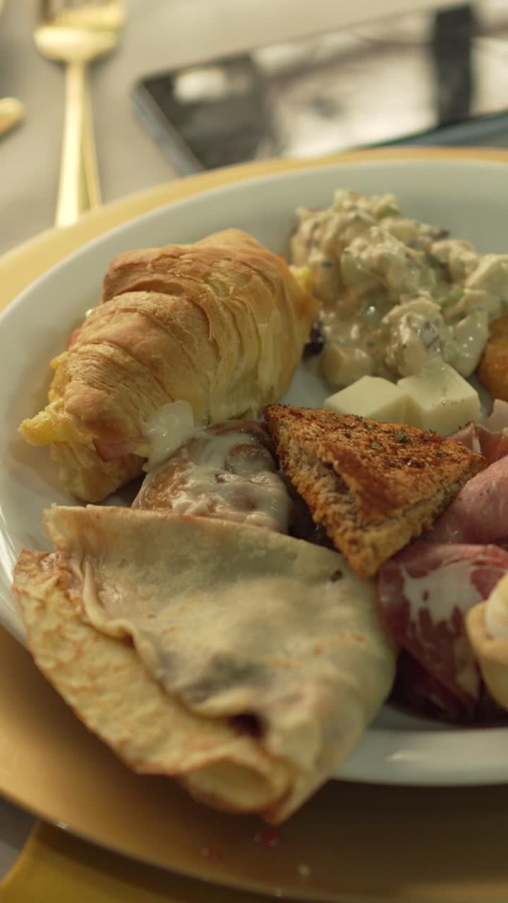 Gourmet breakfast platter Brunch Buffet hearty platter of sweet and savory delights. Vertical
