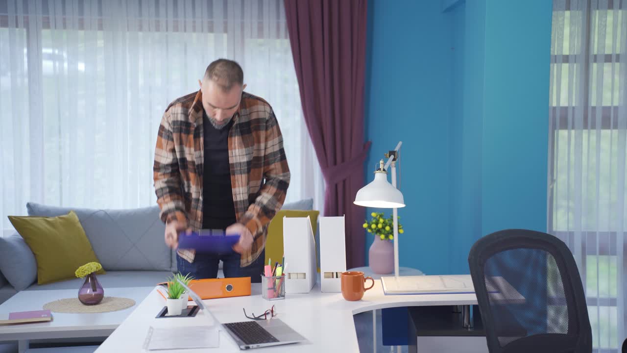 Thoughtful and confused businessman working in home office and brooding.