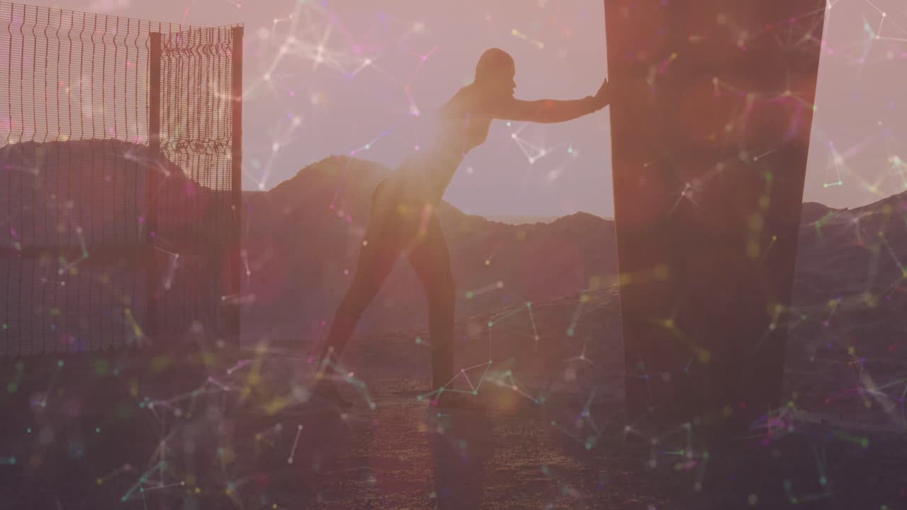 해변에서 스트레칭 운동을 하는 아프리카계 미국인 피트맨에 대한 연결망