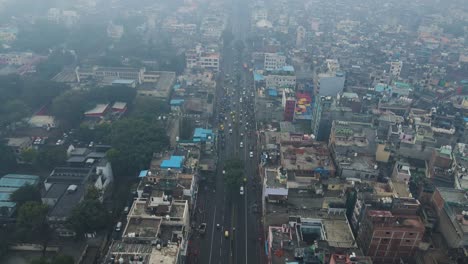aerial drone shot highlighting the dense traffic of chandni chowk, as shoppers and commuters navigate the crowded roads.