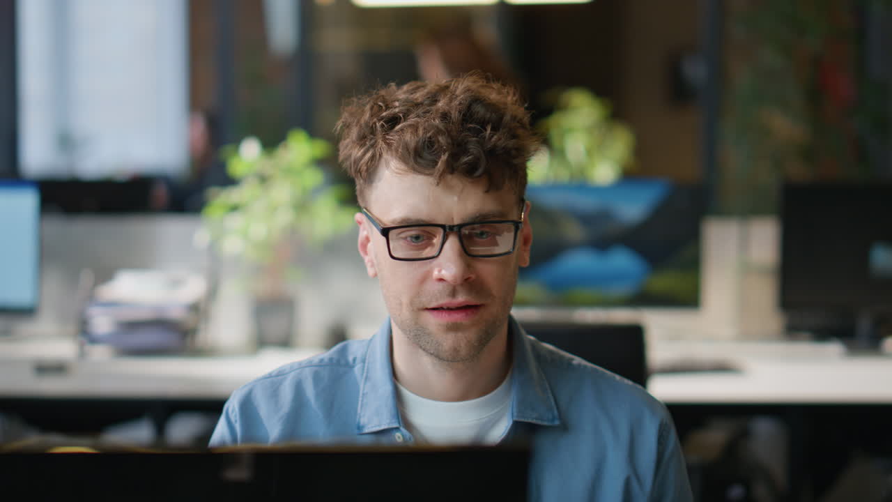 Joyful employee celebrating promotion email in office closeup. Happy man winner