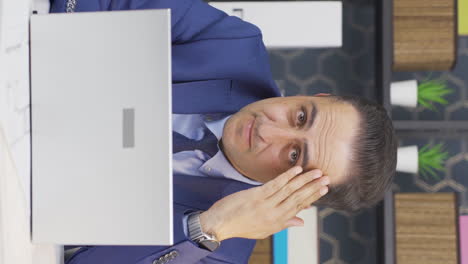 vertical video of well-groomed and smiling positive businessman looking at camera.