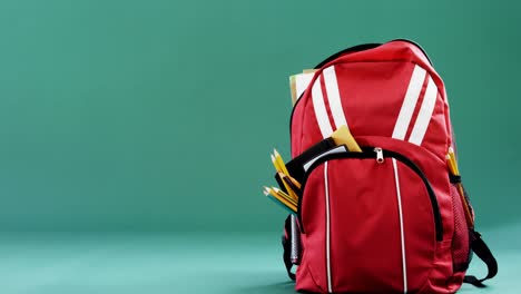 schoolbag on green background