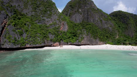 aerial drone video of phi phi leh with maya bay and pileh lagoon, krabi province, thailand. aerial top view of amazing tropical island with turquoise water and white beach, famous travel destination.