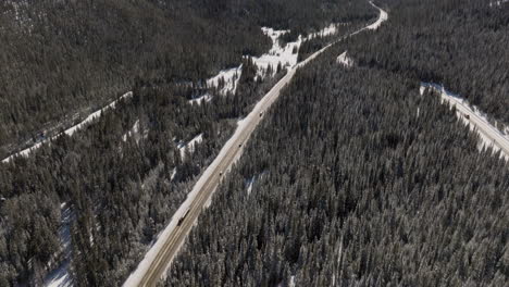 aerial tilting shot of cars driving near winter park in colorado