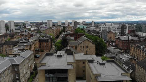 Aerial-view-of-Glasgow-city-center-high-end-apartment-building-rooftops-in-Scotland,-UK