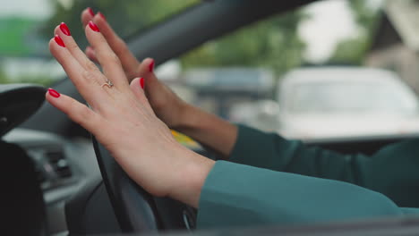 irritated woman hits wheel getting stuck in traffic jam