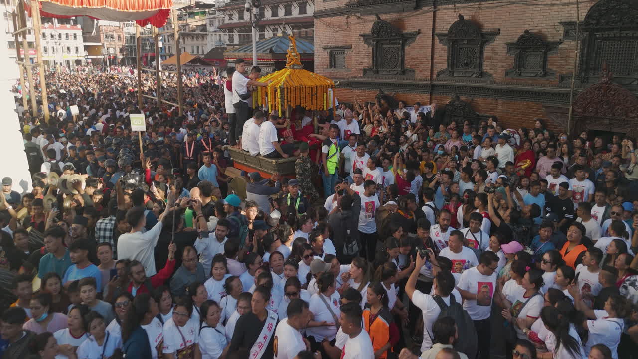 Basantapur Durbar Square in Kathmandu Nepal is filled with diverse ethnic citizens pulling chariot at Indra Jatra festival celebrates Lord Indra, symbolizing unity, harmony, and welfare of country