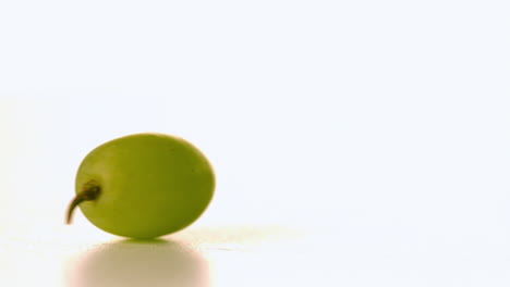 Grape-spinning-on-white-surface