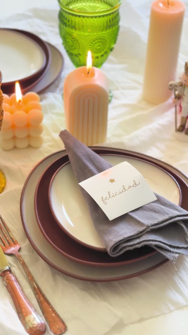 Close-up of Hands Setting a Festive Dining Table with Candles