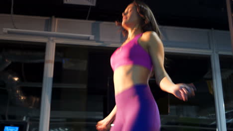 beautiful sporty woman workout with jumping rope in crossfit gym. jump rope.