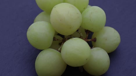 close-up view of a bunch of white grapes isolated on black background