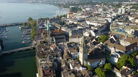 Birds-Eye-View-of-Church-of-St-Peter-and-Fraümunster-Church-in-Zurich,-Switzerland