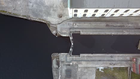 skien sluice in the famous telemark channel norway - top down aerial moving slowly from left to right above sluice with locked gates