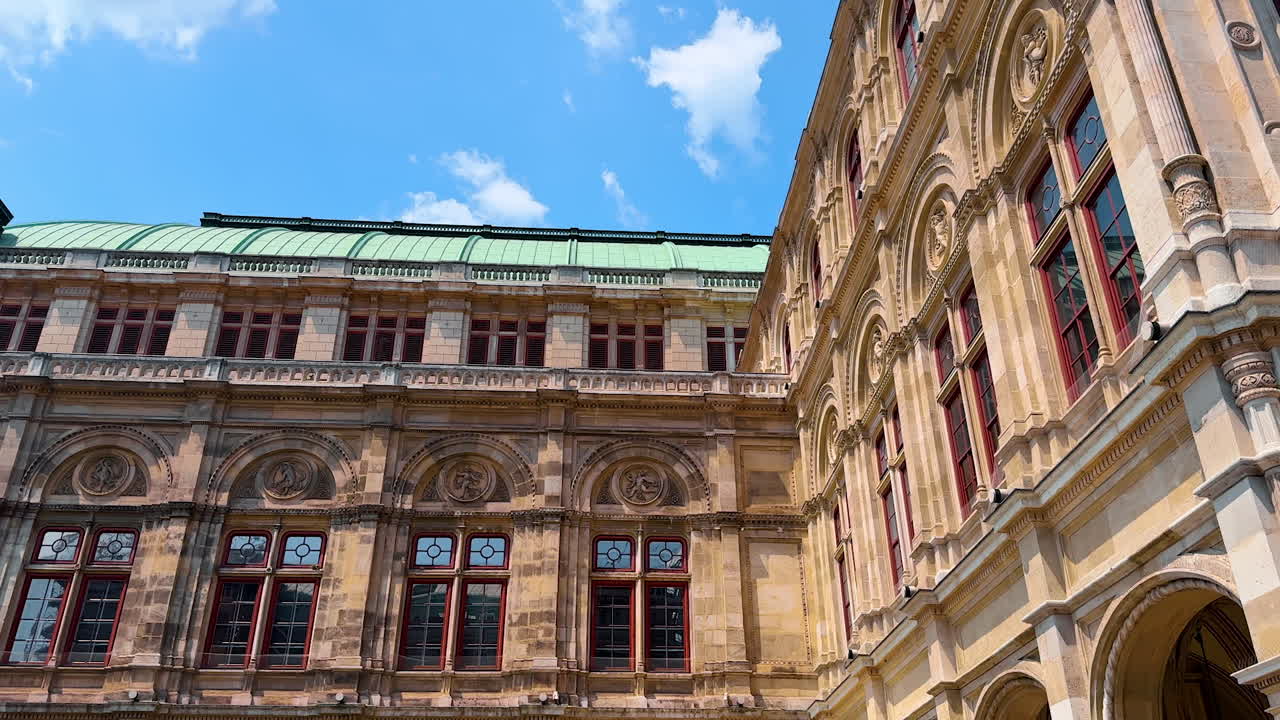 Vienna, Austria - June 9, 2025: Stunning architecture in Vienna, Austria. Tourists admire the intricate details of historic buildings in Vienna on a bright, sunny day in Europe