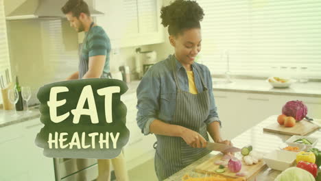 Animation-of-eat-healthy-text-over-diverse-couple-preparing-healthy-meal-in-kitchen